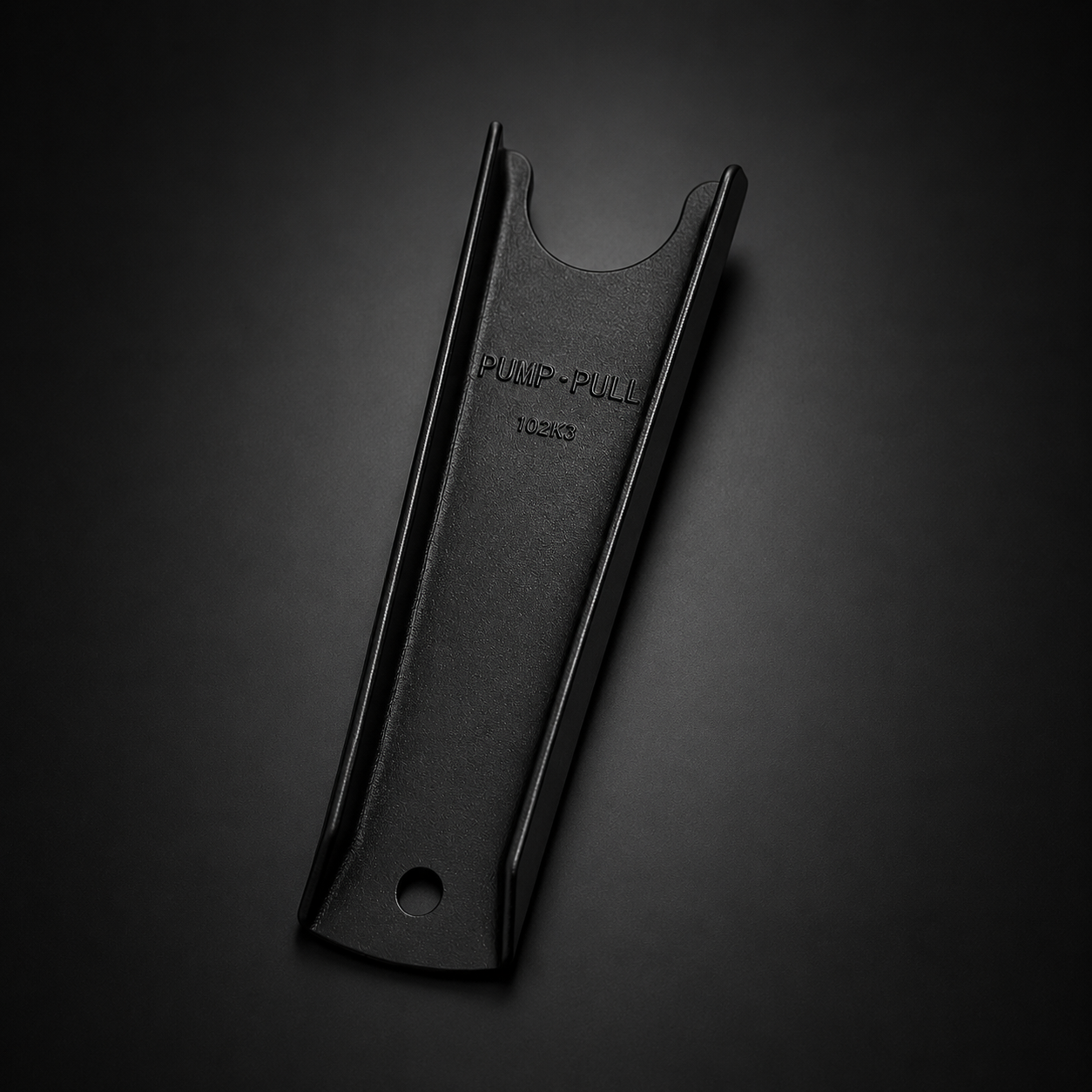 Black boot jack with 'Pump-Pull Tools' branding on a dark background